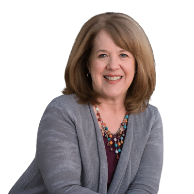 Professional headshot of Ann O'Brien, smiling and facing the camera.
